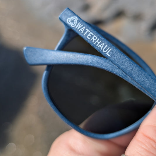 recycled ghost net sunglasses with a blue frame