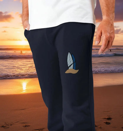 Man wearing Board Meeting Jogging Bottoms organic cotton fleece-lined joggers for surf and beach adventures