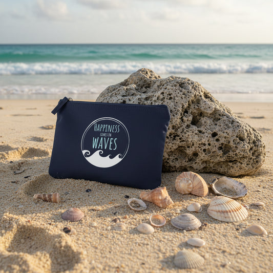 Navy pouch with 'Happiness Comes in Waves' text and wave design on a white background