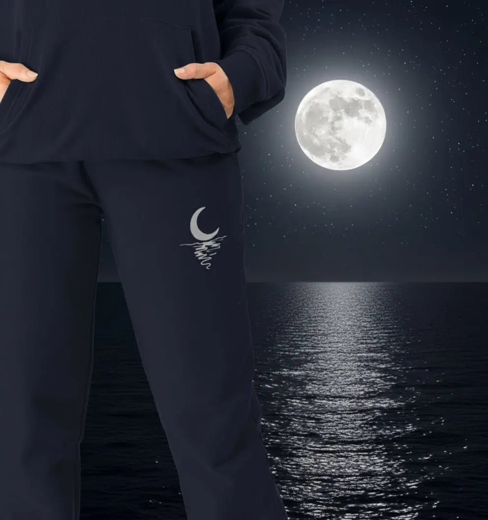 Woman wearing Moonlight Jogging Bottoms organic cotton fleece-lined joggers for cozy nights and outdoor adventures