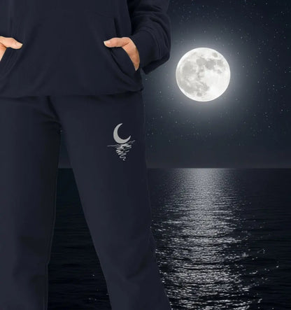 Woman wearing Moonlight Jogging Bottoms organic cotton fleece-lined joggers for cozy nights and outdoor adventures