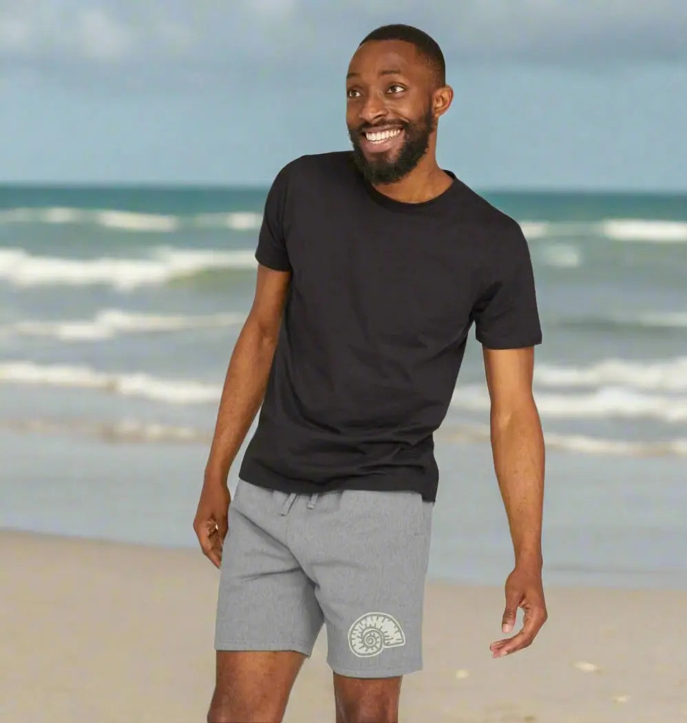 Eco-friendly men’s shorts with nautilus fossil shell design, sustainable jogger shorts for beach and surf lifestyle