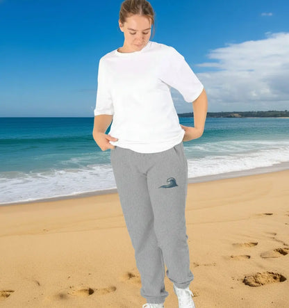 Woman enjoying a coastal adventure in her grey coloured fleece-lined women’s jogging bottoms for comfort and warmth