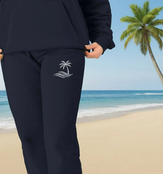 Woman wearing Palm Trees Jogging Bottoms organic cotton fleece-lined joggers for beach lovers and coastal adventures