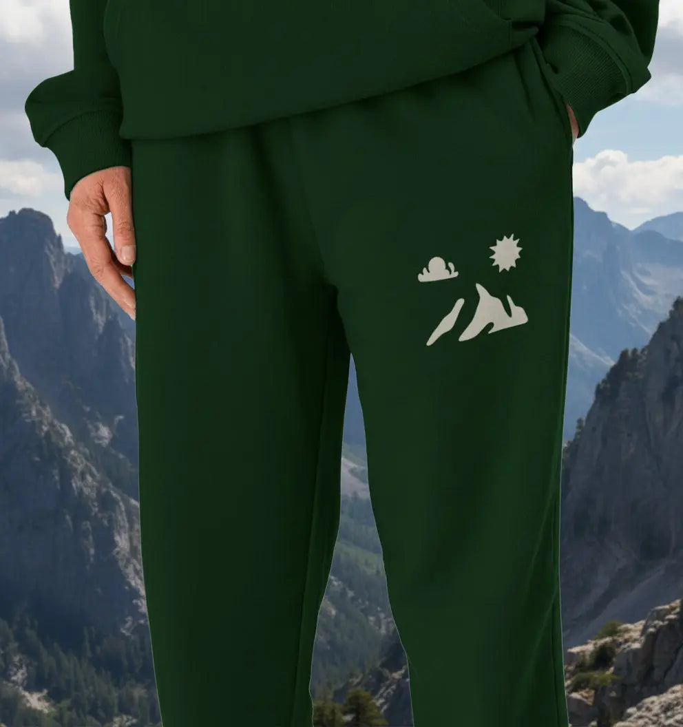 Man wearing Summit Men’s Jogging Bottoms organic cotton fleece‑lined joggers for mountain hiking and trail adventures
