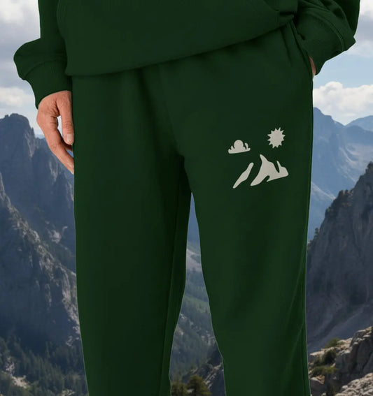 Man wearing Summit Men’s Jogging Bottoms organic cotton fleece‑lined joggers for mountain hiking and trail adventures