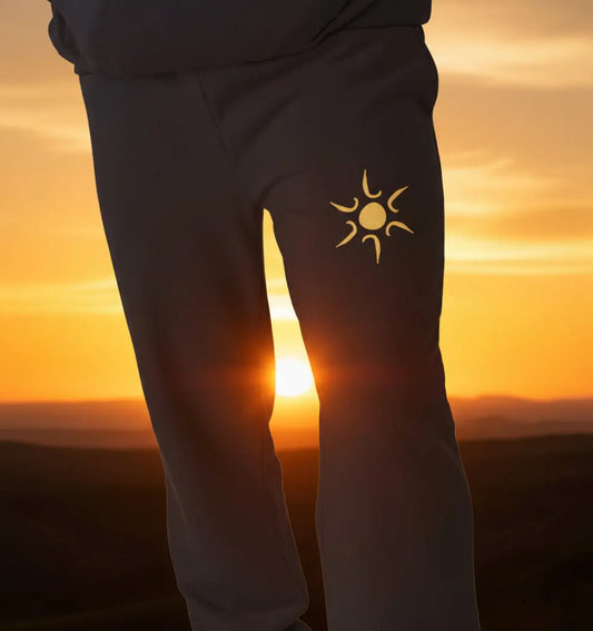 Man wearing Sunshine Jogging Bottoms organic cotton fleece-lined joggers for surf and beach adventures