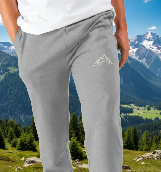 Man wearing The Peaks Jogging Bottoms organic cotton fleece-lined joggers for hiking and outdoor adventures