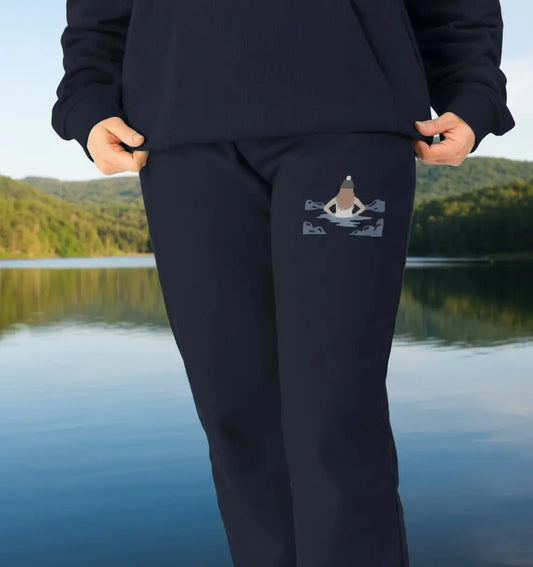 Woman wearing Wild Dipper Jogging Bottoms Navy organic cotton fleece-lined joggers for wild swimming and outdoor adventures