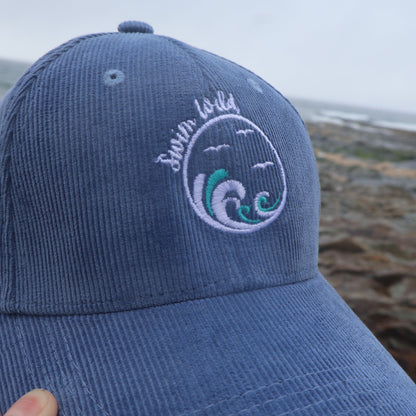 Blue swim wild organic cotton cap with embroidered design