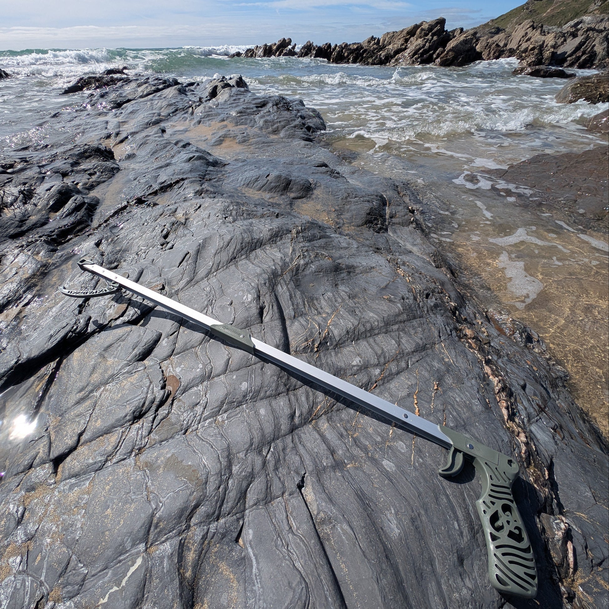recycled ghost net litter picker on a beach 
