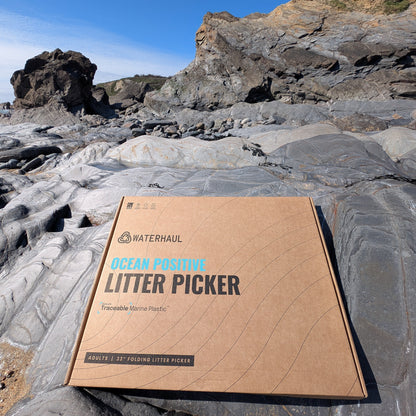 recycled cardboard box with the recycled ghost net litter picker in it 