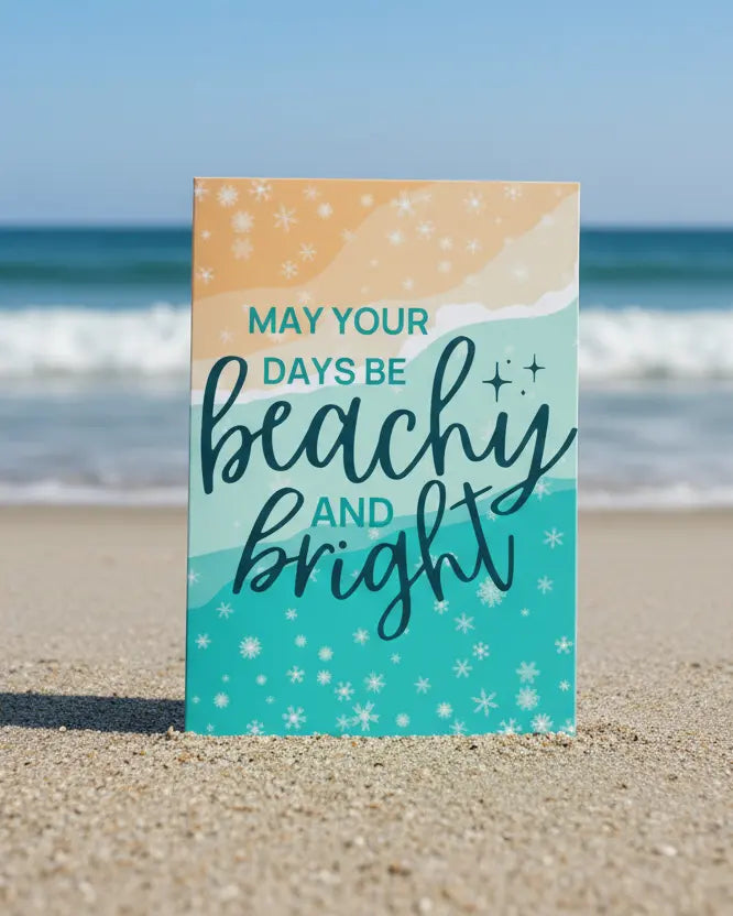 A Christmas greeting card with 'Beachy and Bright' text design, on a beach. 
